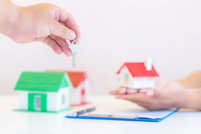 Real estate agent with house model keys